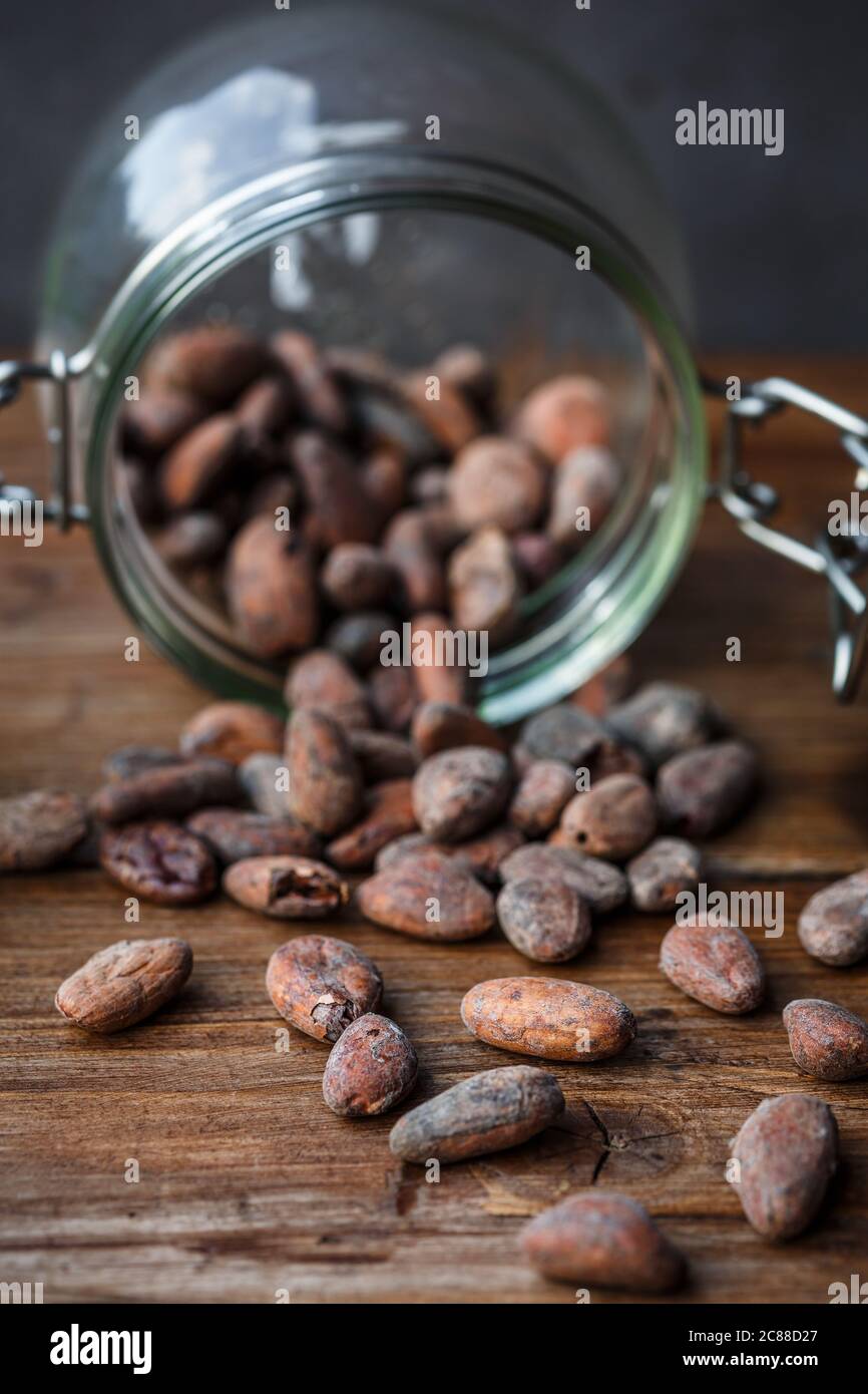 Cacao beans in a glass container Stock Photo