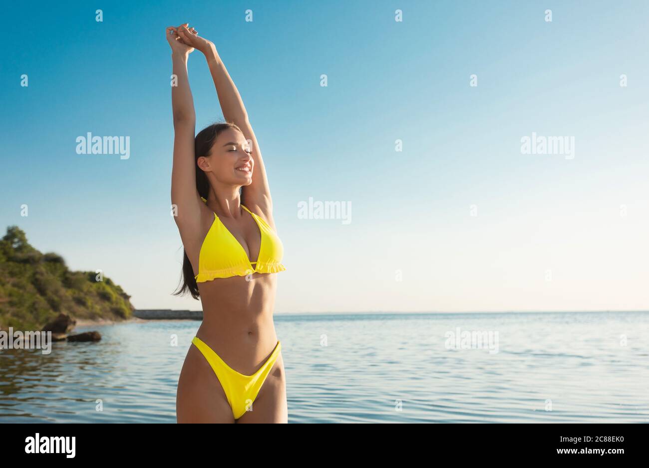 Girl Sunbathing Near Sea Wearing Bikini Swimsuit Relaxing Outdoor Stock