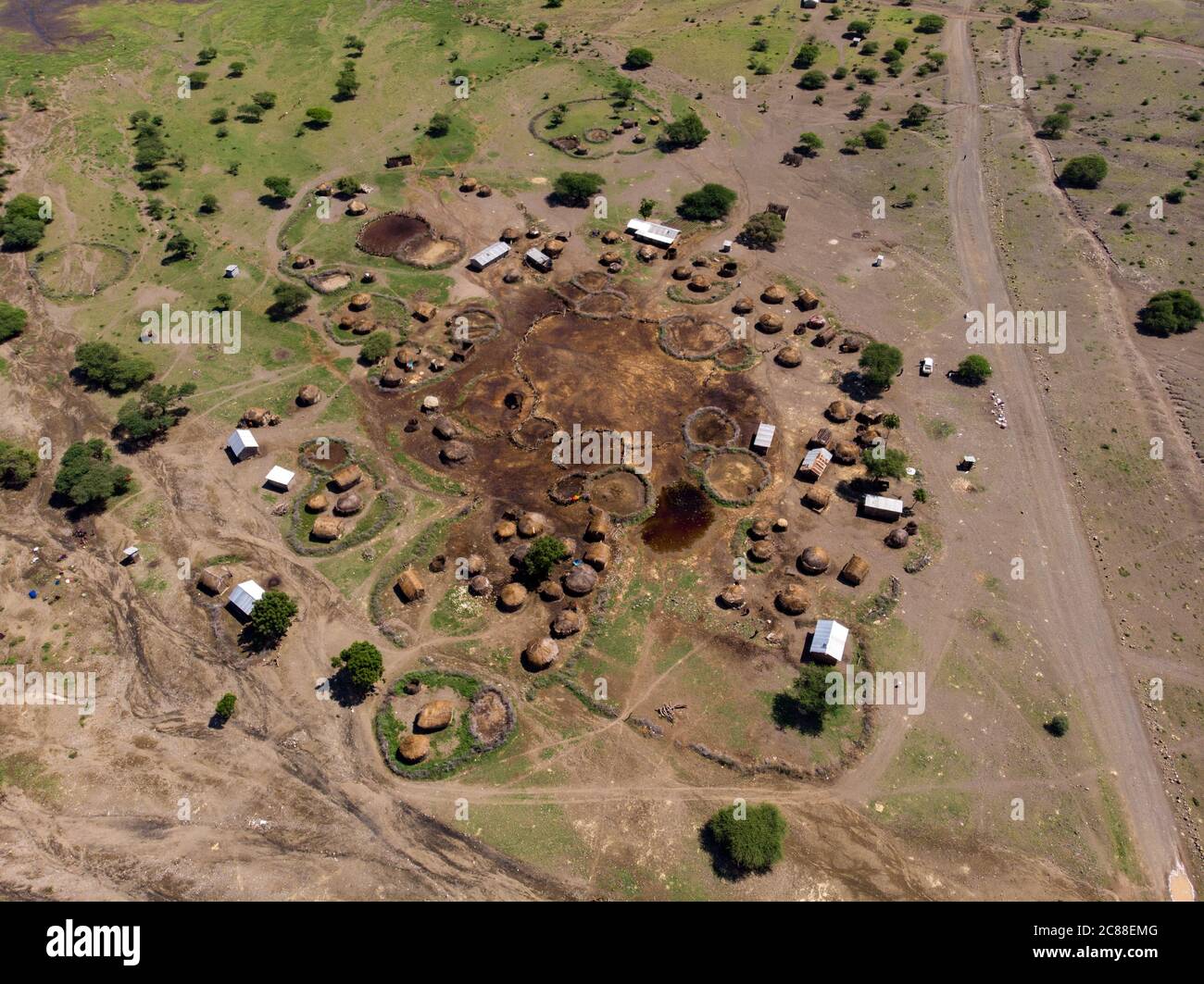 Aerial view of Maasai boma or family rural village on the coast of