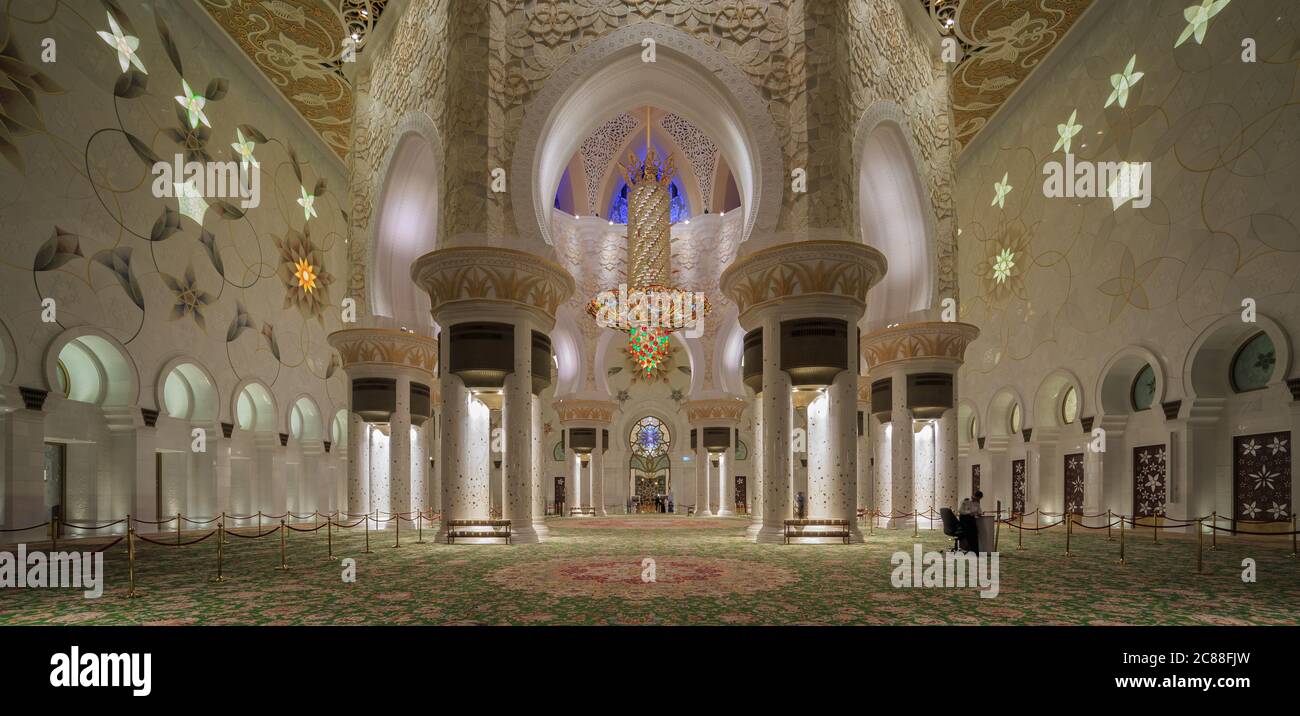 Sheikh Zayed Grand Mosque Center in Abu Dhabi, United Arab Emirates interior  view showing chandeliers , golden decoration and  carpets Stock Photo