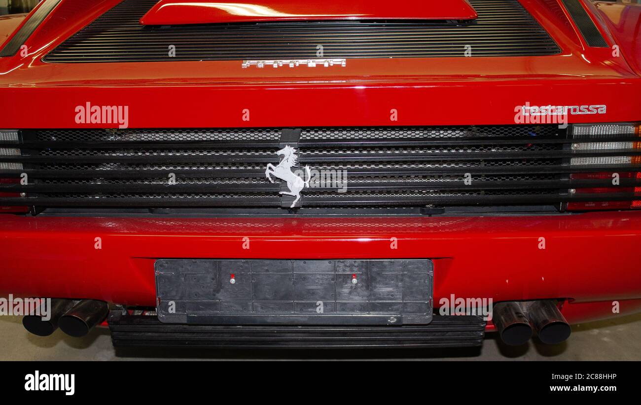 Photo of a Ferrari Testarossa rear section with logo. Photographed from behind. Stock Photo