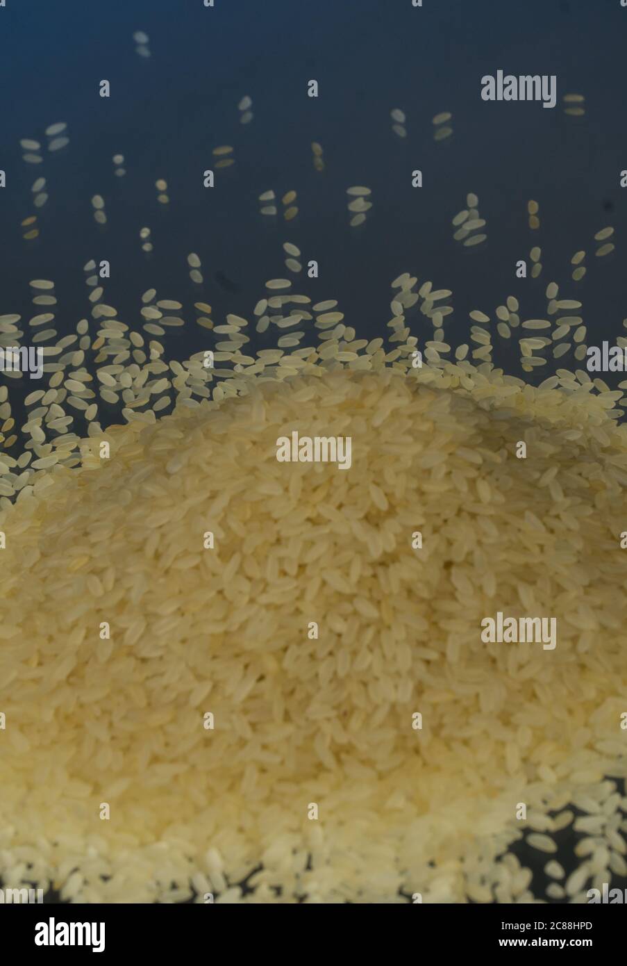Studio Photo Rice Raw rice as background. Mirror. Studio photography Stock Photo - Alamy