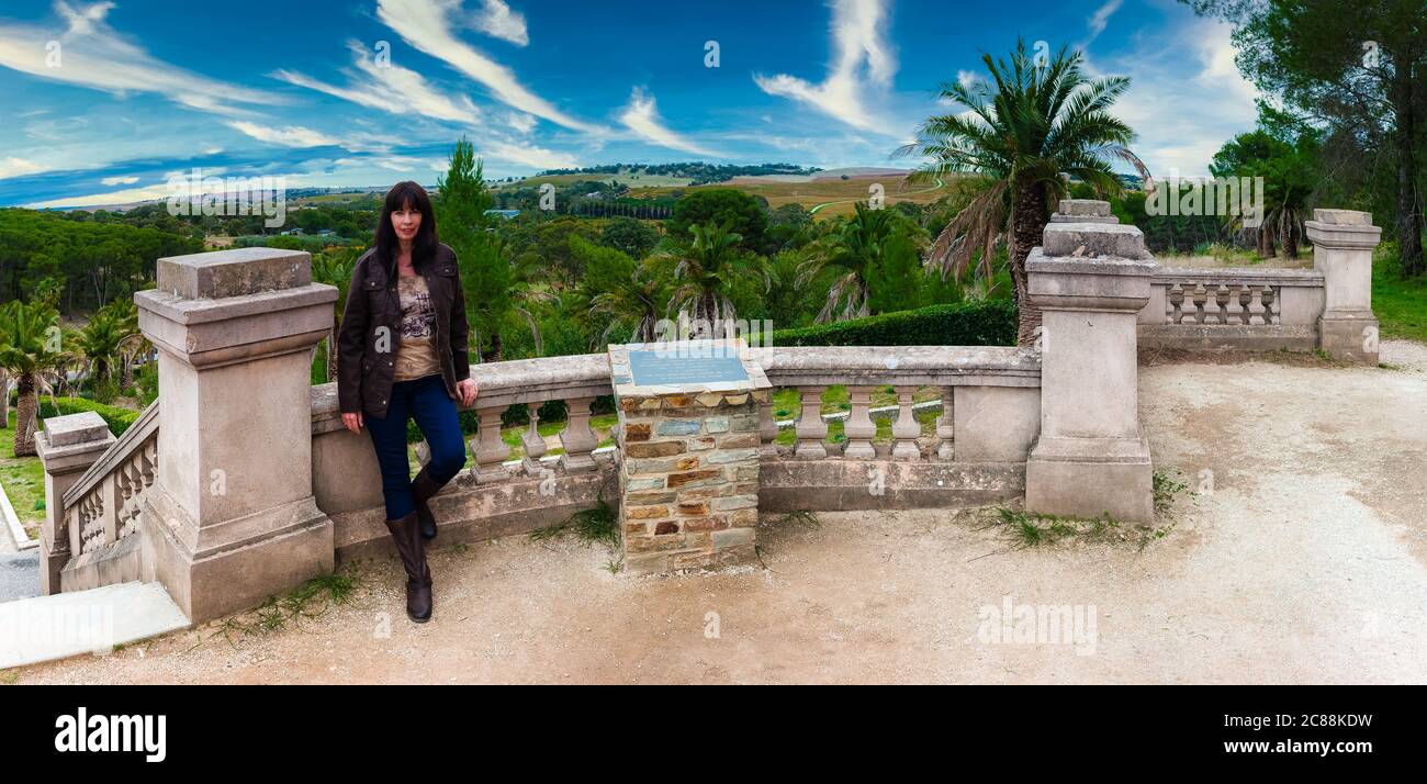 A panoramic vista with female tourist leaning on balcony at the Seppelt Family Mausoleum which overlooks the Barossa Valley in South Australia. Stock Photo