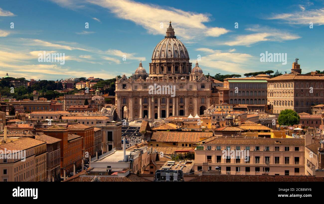View of St. Peter's Basilica in the Vatican, over the roofs of Rome Stock Photo