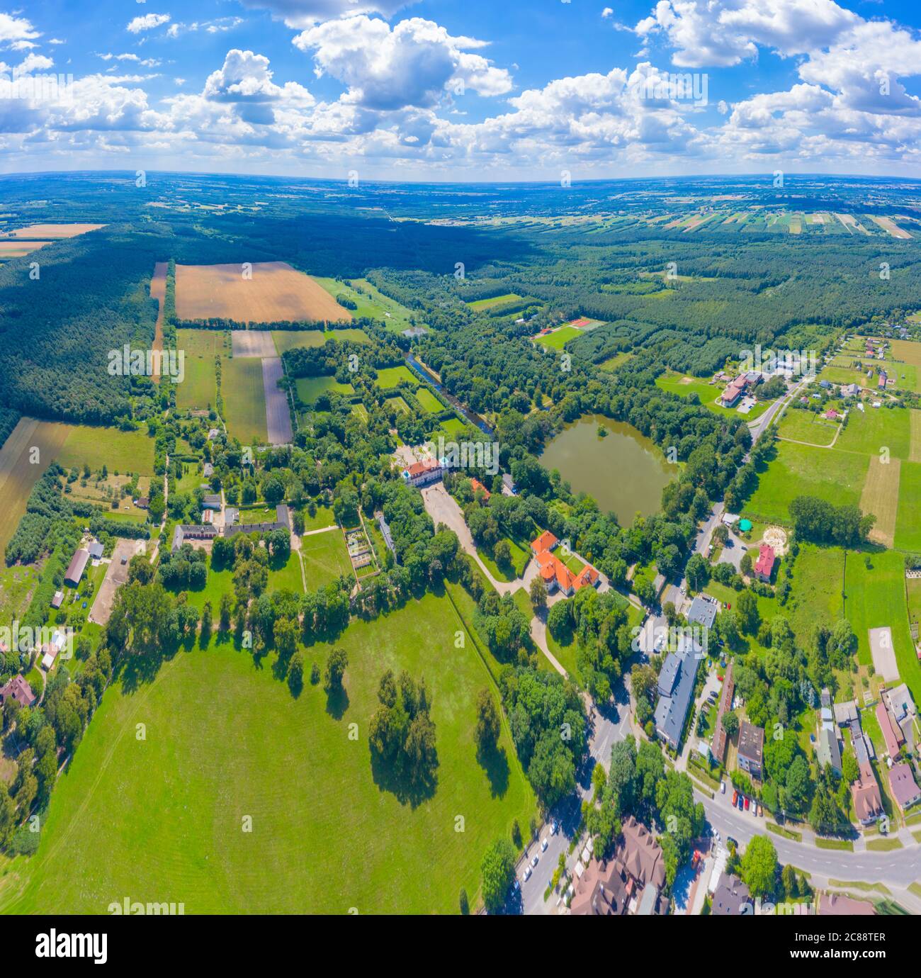 Aerial panorama of Beautiful avenue of trees in the grounds of Nieborow Palace, a Baroque style residence in Poland. Colourful French-design garden Stock Photo