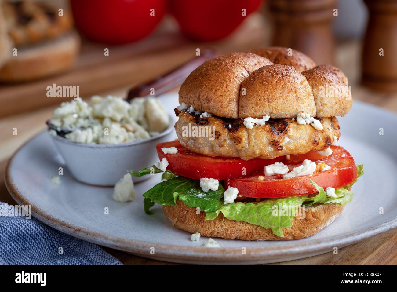 Grilled turkey burger sandwich with tomato, lettuce and blue cheese