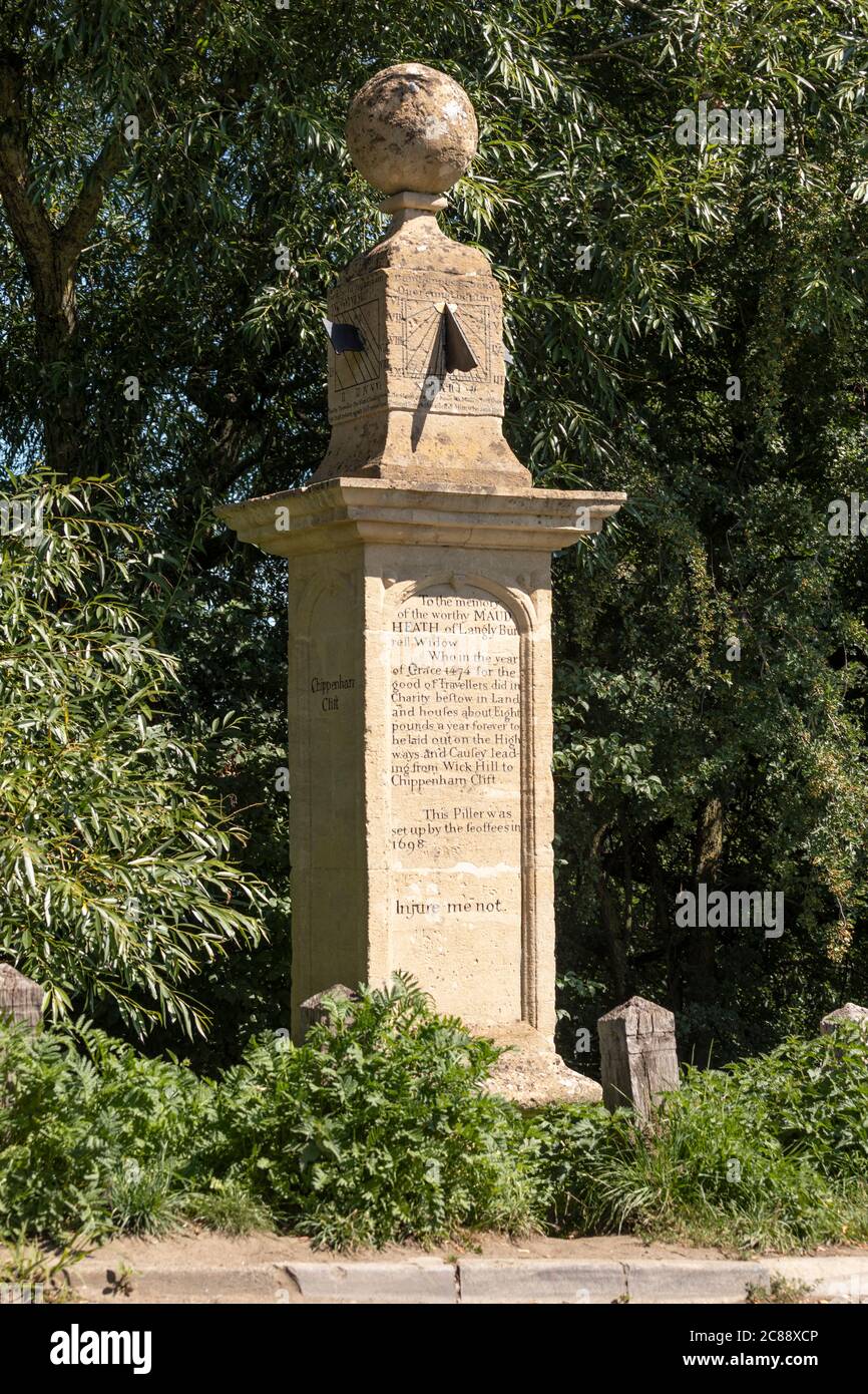 Carved stone sundial pillar dated 1698 a memorial for benefactor Maud Heath, from Langley Burrell, Wiltshire, England, UK Stock Photo