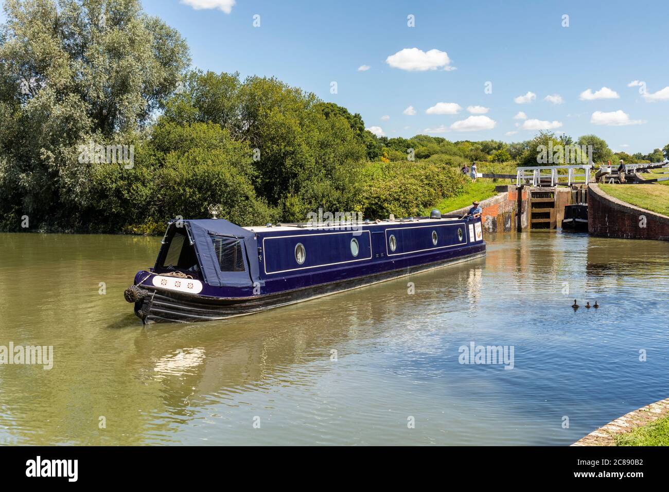 Lock gates open and Canal Boats on Caen Hill Locks, Kennet and Avon Canal, Devizes, Wiltshire, England, UK Stock Photo