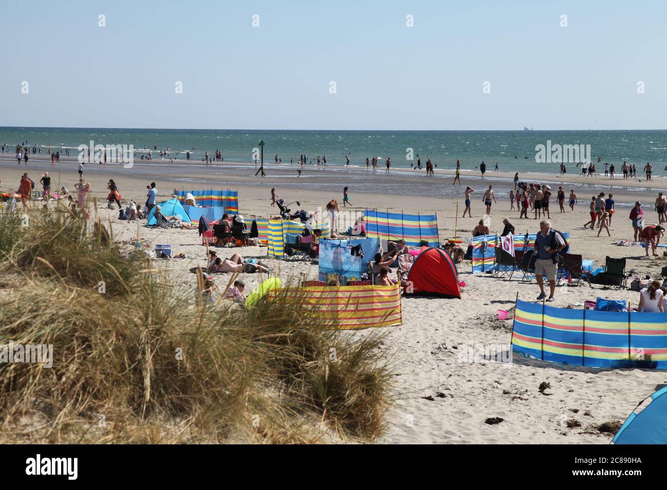 Crowds of people head to the beach after CoViD lockdown eases at West Wittering beach, Chichester, UK, July 2020 Stock Photo