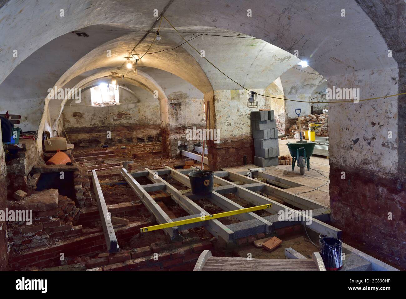 Inside crypt of Bristol church with tombs and concrete beams installed above, undergoing restoration and preservation. Graves from 1740's to late 1800 Stock Photo
