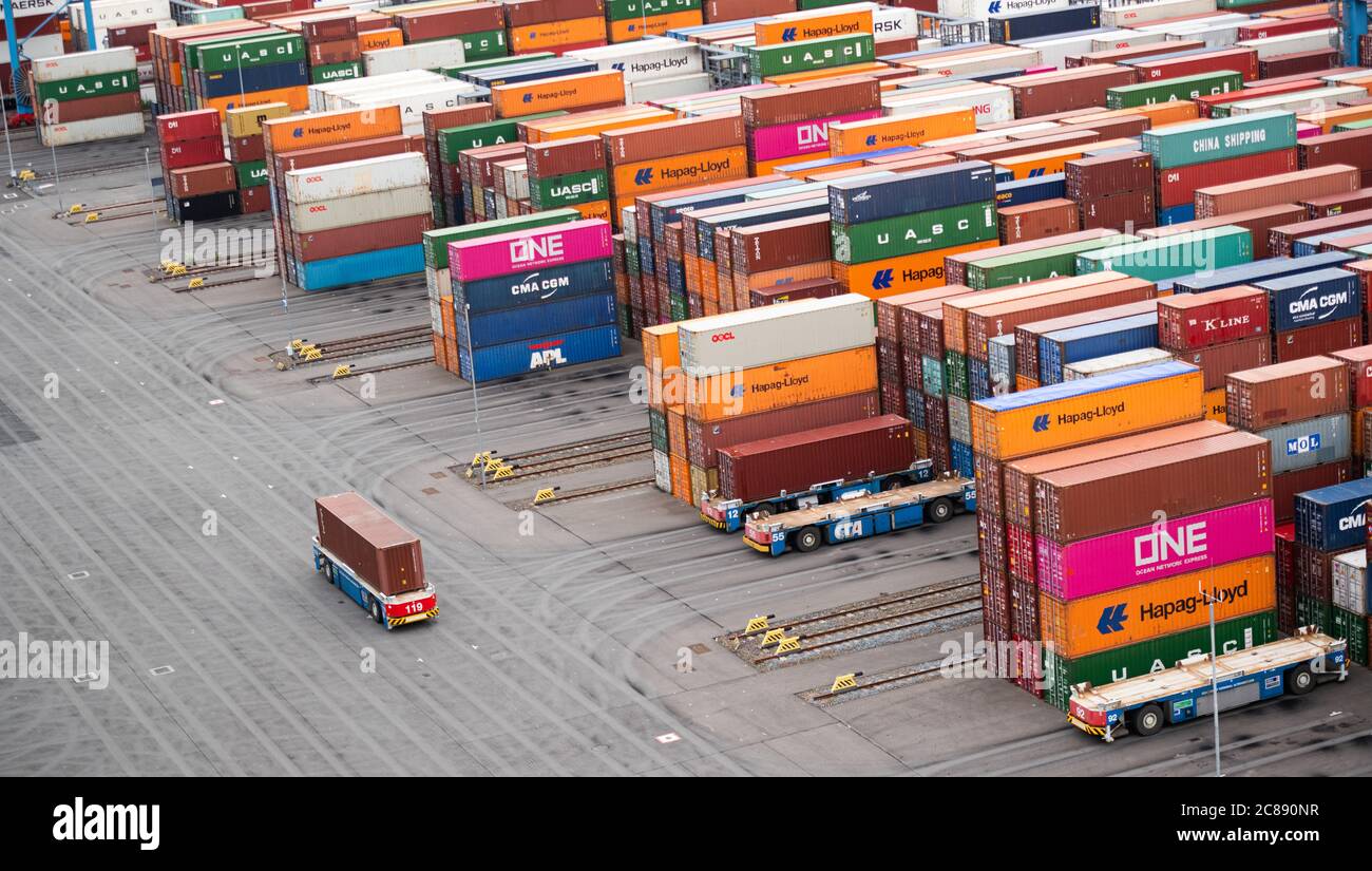 Hamburg, Germany. 16th July, 2020. An "Automated Guided Vehicle", AGV for short, takes a container to a block storage facility at Container Terminal Altenwerder in the Port of Hamburg. Credit: Daniel Reinhardt/dpa/Alamy Live News Stock Photo