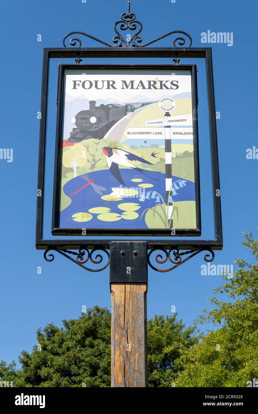 Hanging village sign at the Hampshire village of Four Marks, Hampshire