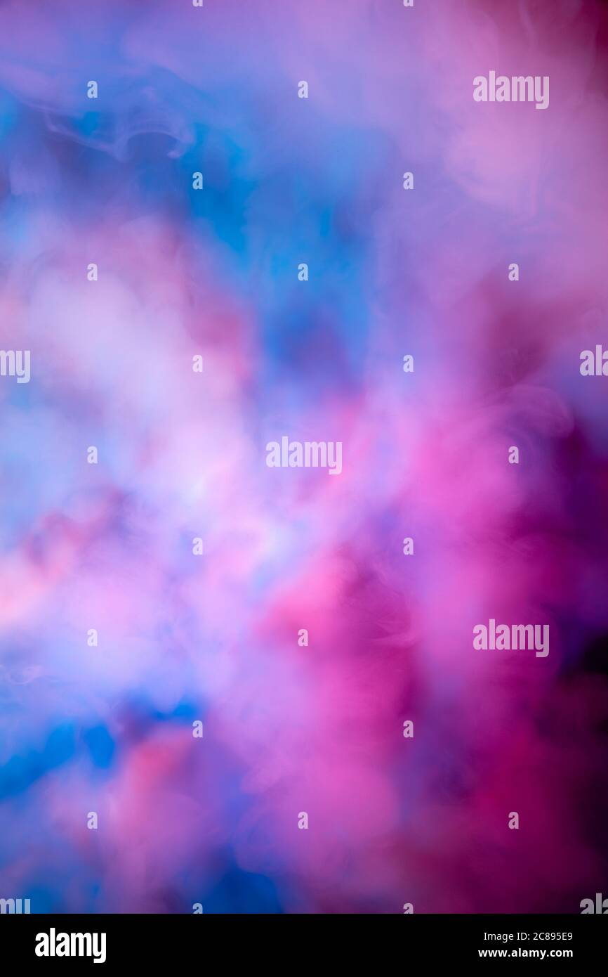 Abstract colorful, multicolored smoke spreading, bright background for  advertising or design, wallpaper for gadget. Neon lighted smoke texture,  blowing clouds. Modern designed Stock Photo - Alamy