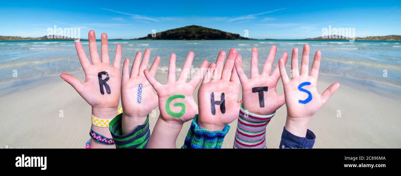 Children Hands Building Word Rights, Ocean Background Stock Photo - Alamy