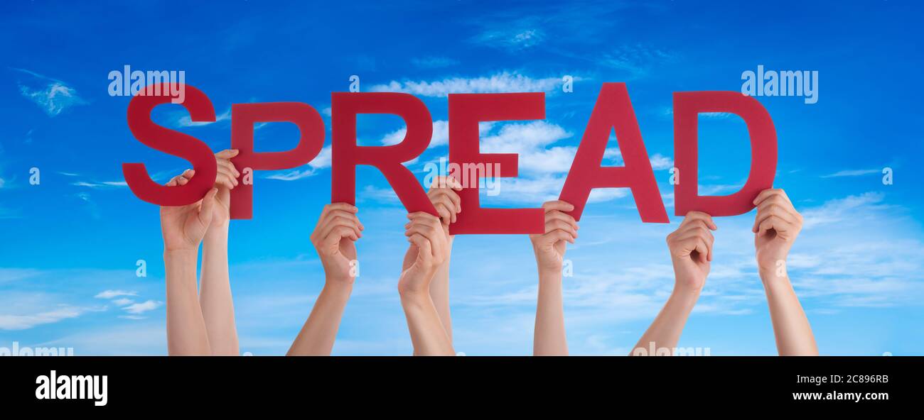 People Hands Holding Word Spread, Blue Sky Stock Photo - Alamy