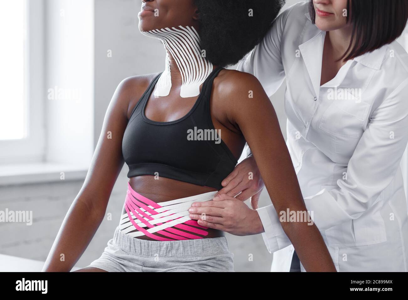 Weight loss concept.Kinesiology taping.Therapist applying kinesiology