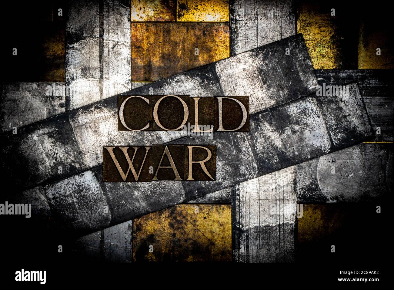 Cold War text formed with real authentic typeset letters on vintage  textured silver grunge copper and gold background Stock Photo - Alamy