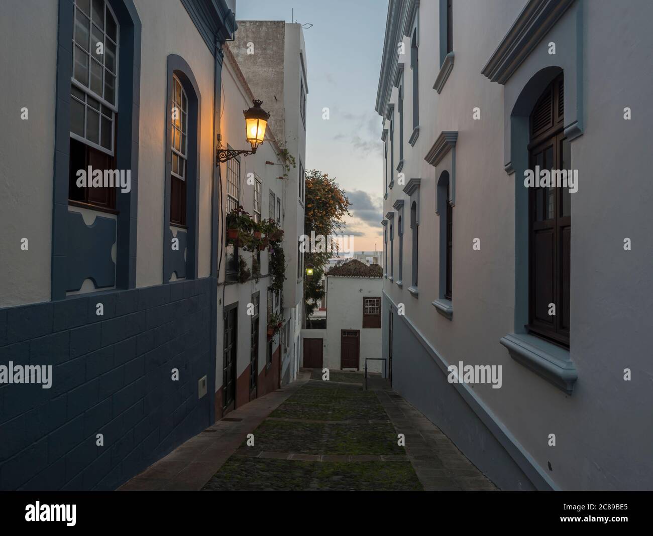 Evening empty narrow street at Santa Cruz de la Palma city center with ...
