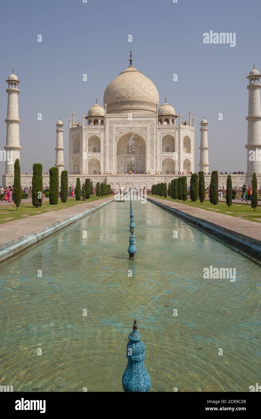 Head-on vertical symmetrical photograph of Taj Mahal on sunny April day Stock Photo