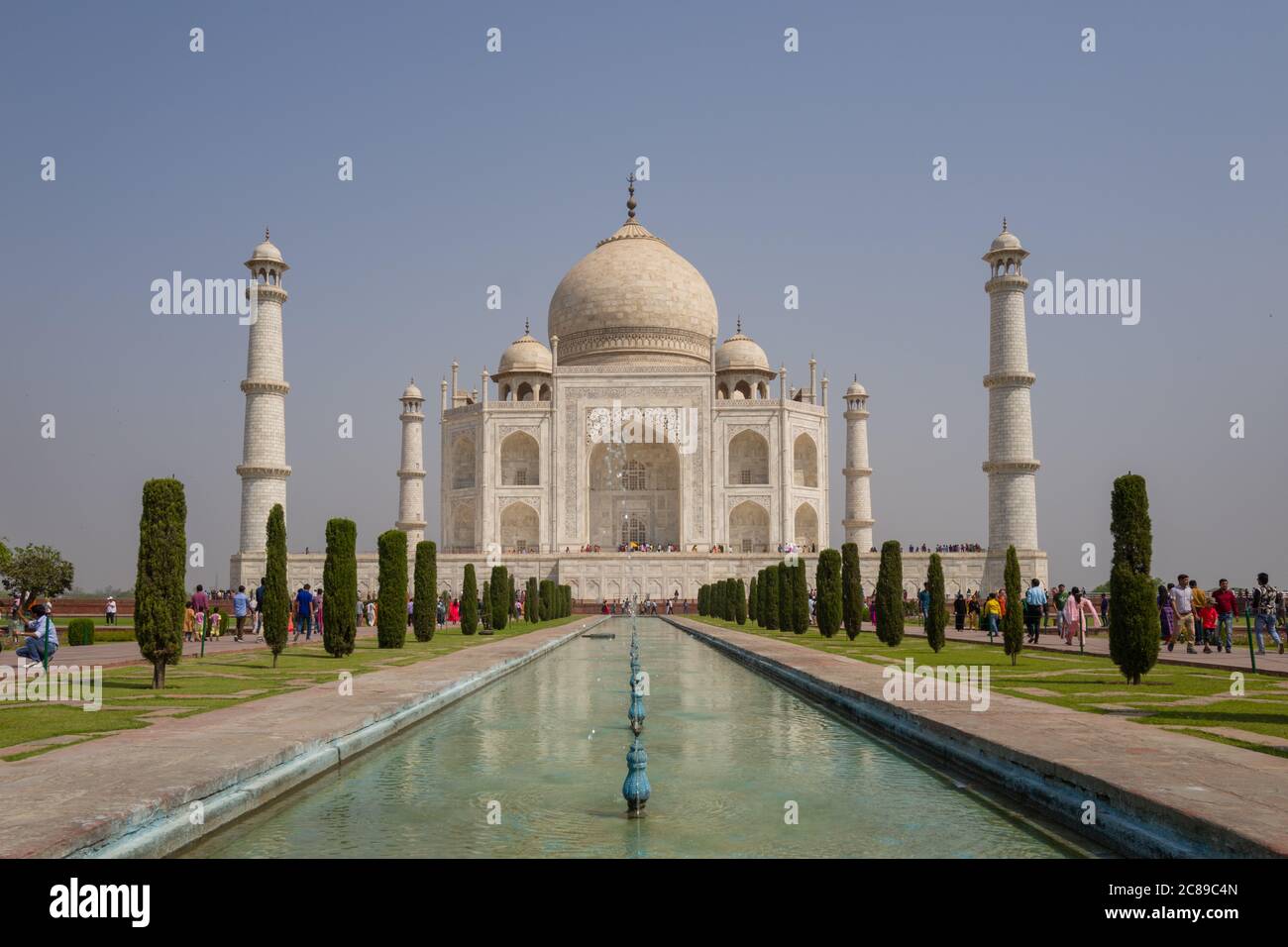 Head on symmetrical photograph of Taj Mahal on sunny April day Stock Photo