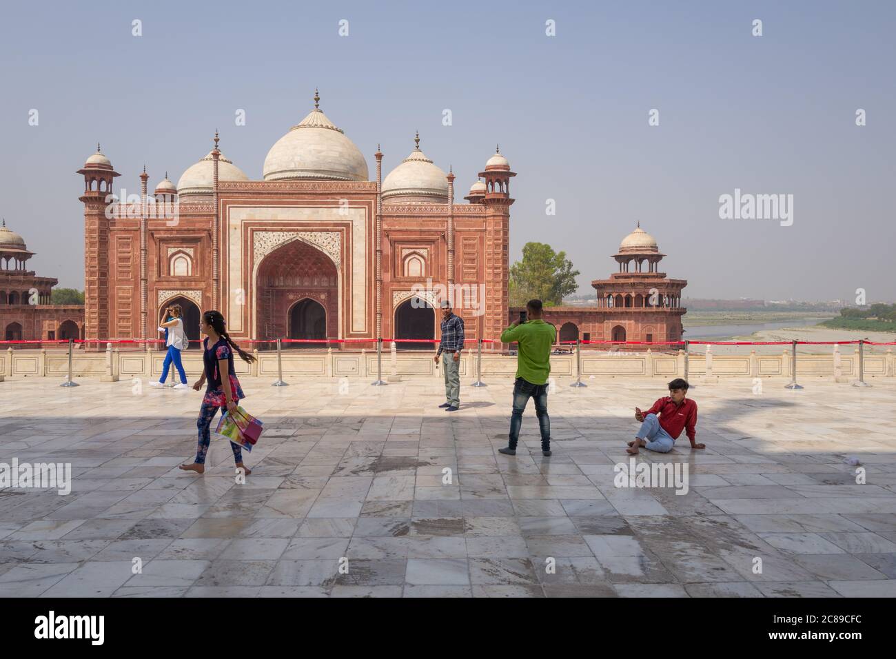 Visitors in front of outlying mosque facing the Taj Mahal, on southern bank of River Yamuna in Agra, India Stock Photo