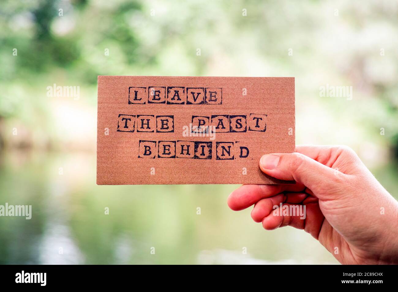 Cardboard letters made by alphabet stamps spelled out on cardboard  backgrounds Stock Photo - Alamy