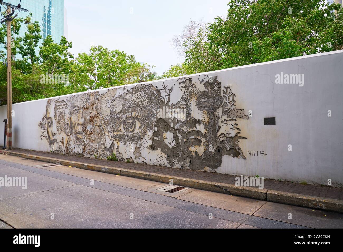 Portuguese artist Alexandre Farto created this art work on the wall of the Portuguese Embassy in Bangok his artist name is Vhils Stock Photo