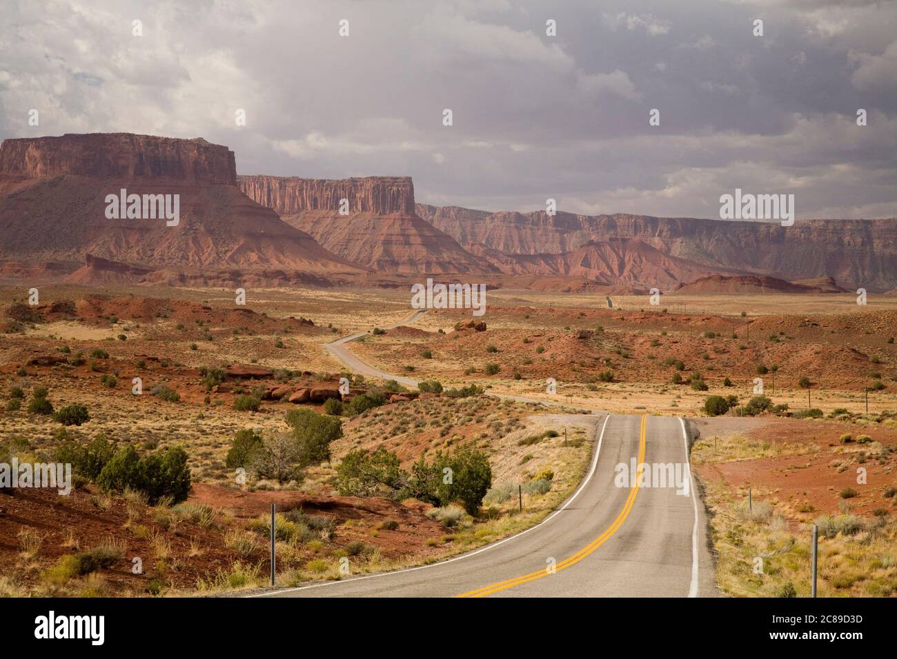 Looking down highway 128 at mesas in the Castle Valley along the Colorado River near Moab, Utah Stock Photo