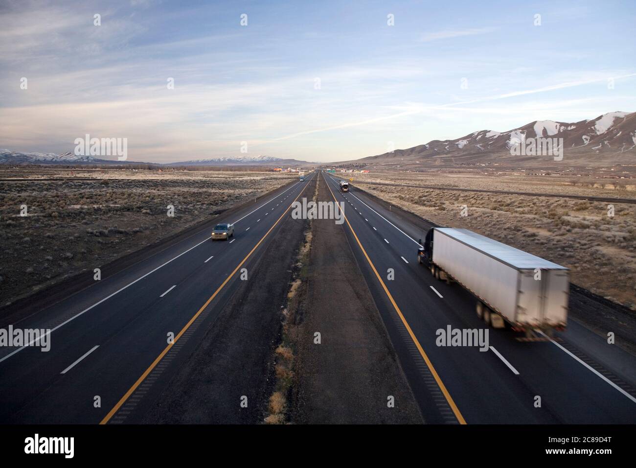 Perspective view of truck heading towards the horizon along Interstate
