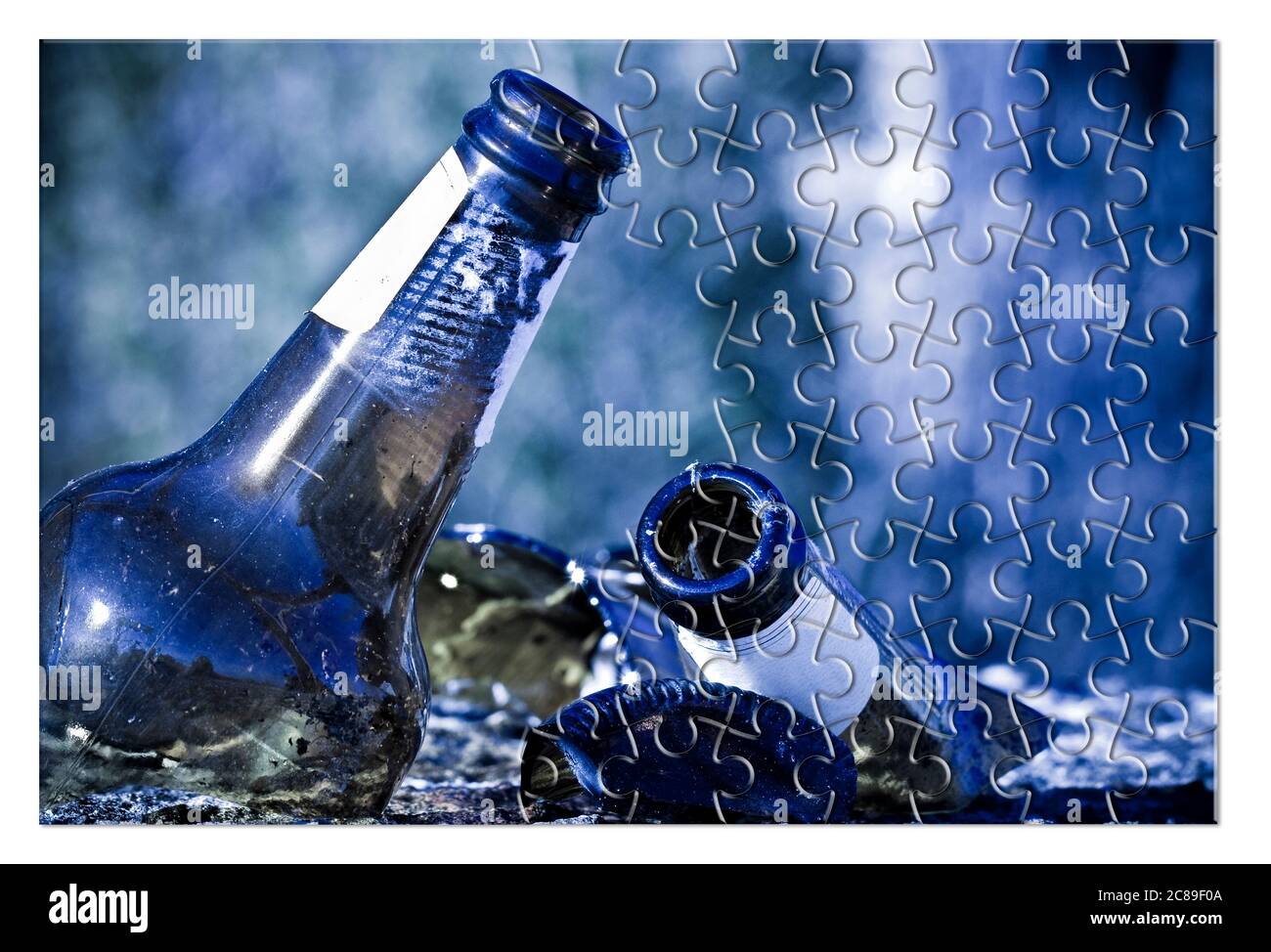 Smashed bottle of beer resting on the ground - Address the alcoholism issue  - Concept image in jigsaw puzzle shape Stock Photo