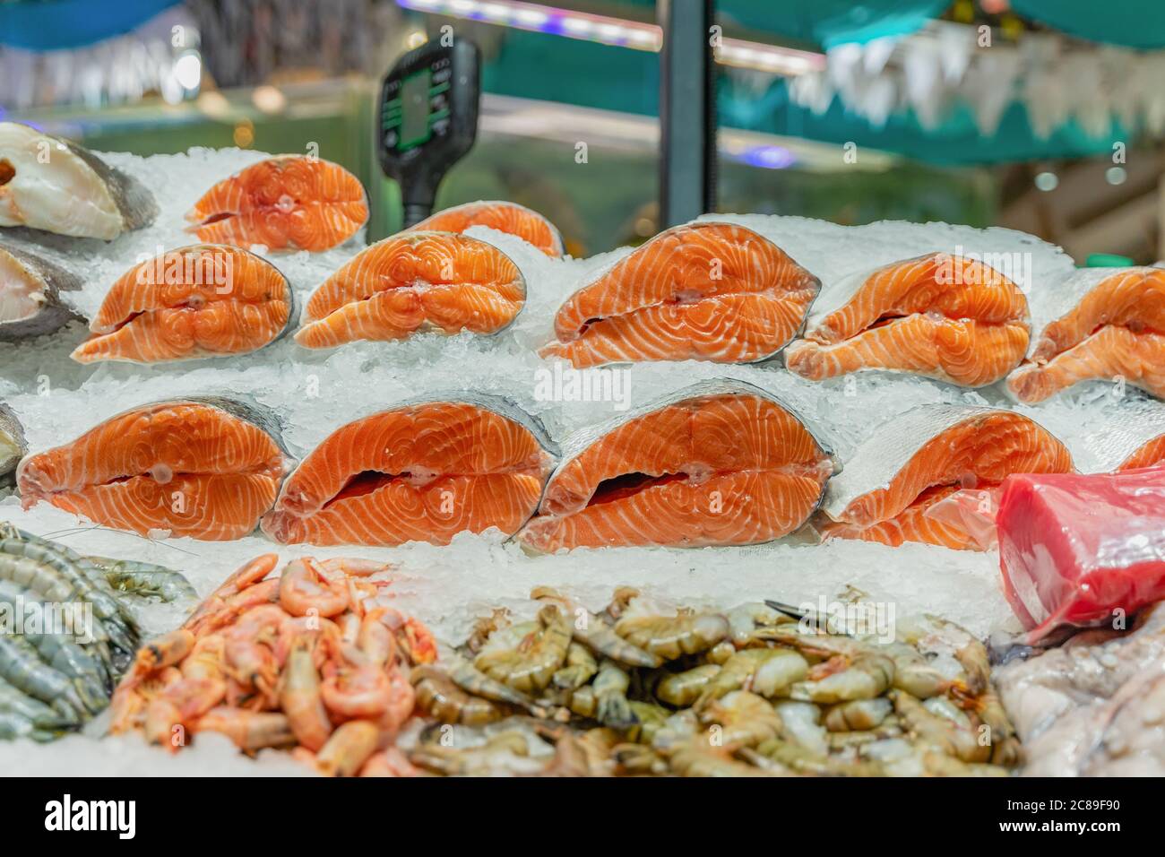 Fresh salmon steaks of salmon on ice in supermarket closeup. Sale of
