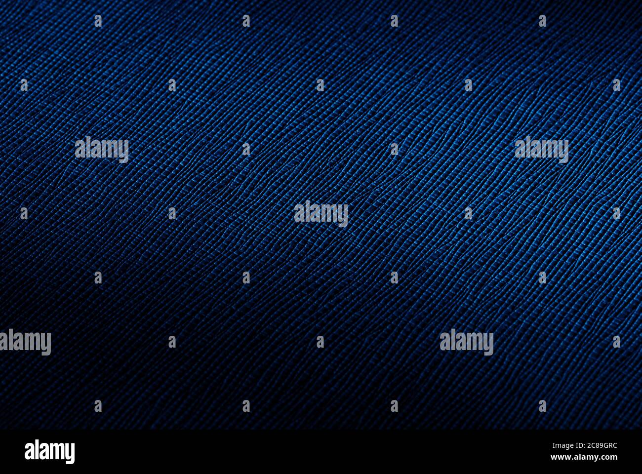 rich dark blue abstract texture background with spot of light Stock Photo