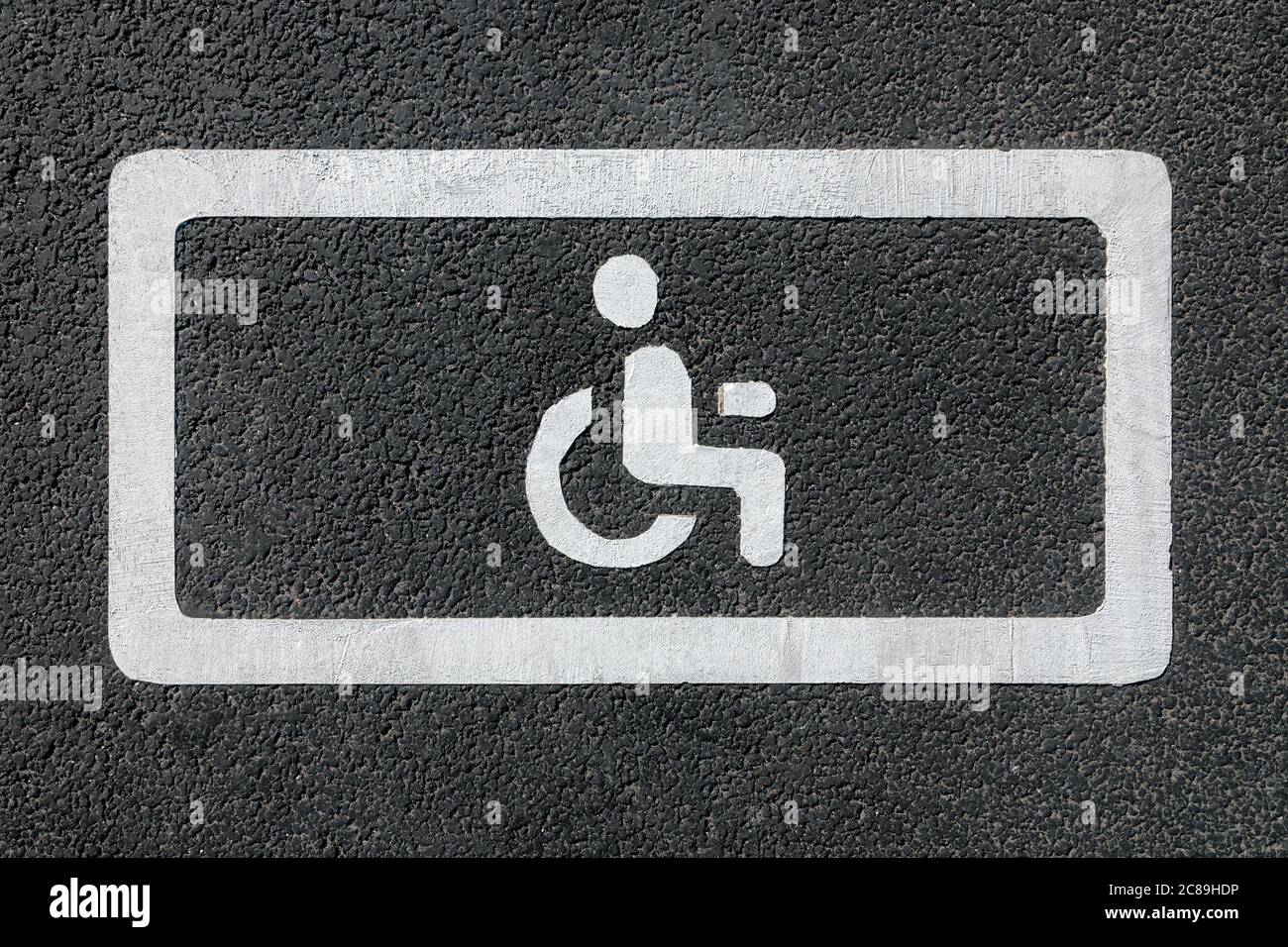 disabled parking sign on asphalt, top view Stock Photo