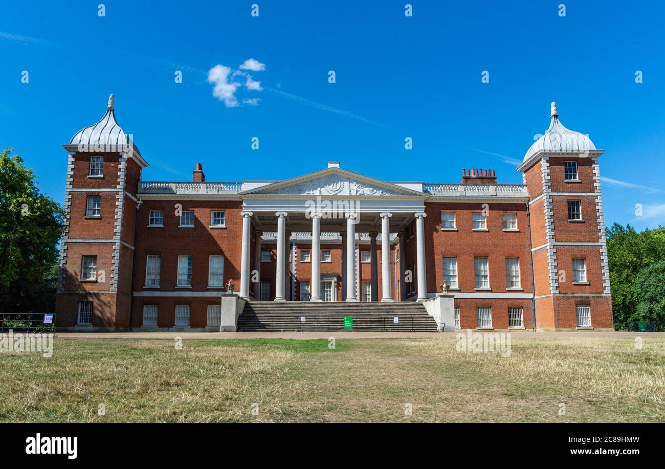 The front of Osterley House with grass fading in the hot sun. No people. Osterley, Isleworth, England. Stock Photo