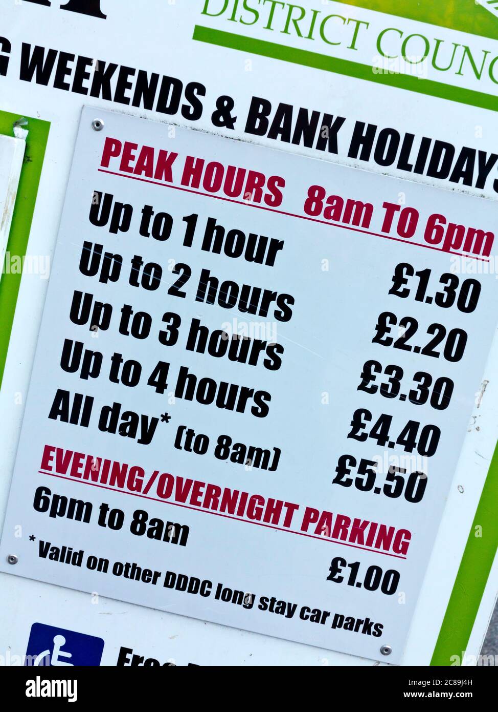 Parking charges displayed on a sign in a car park operated by