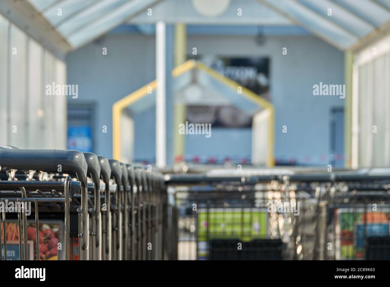 Shopping carts are in the row, depth of field. Goeppingen. Stock Photo
