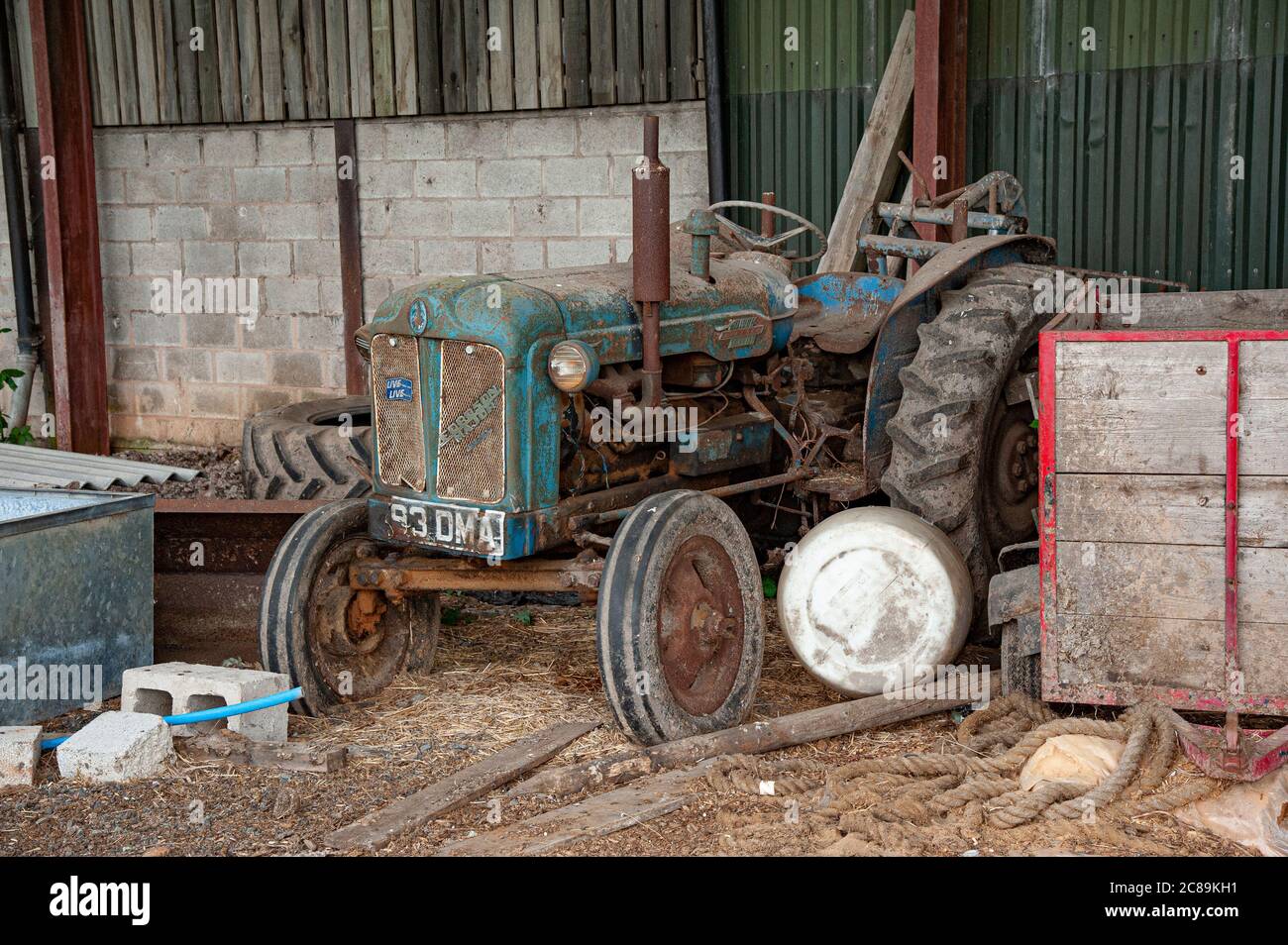 Old Fordson Major tractor in a farm building, Sandbach, Cheshire.UK Stock Photo