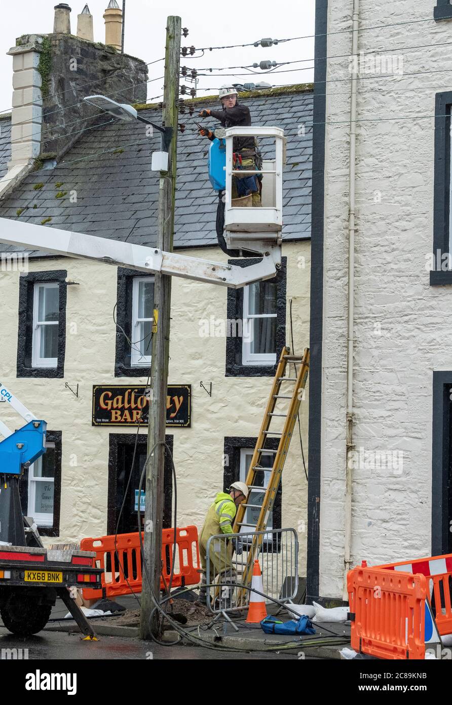 Keltbray electrical engineers replace overhead power cables in Wigtown town centre, Dumfries & Galloway, Scotland. Stock Photo