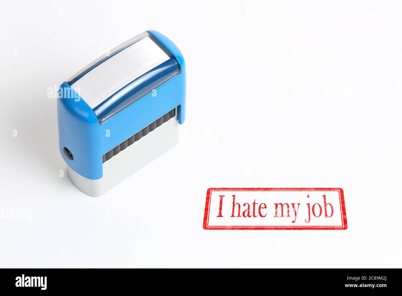I hate my job stamped on white paper surface Stock Photo
