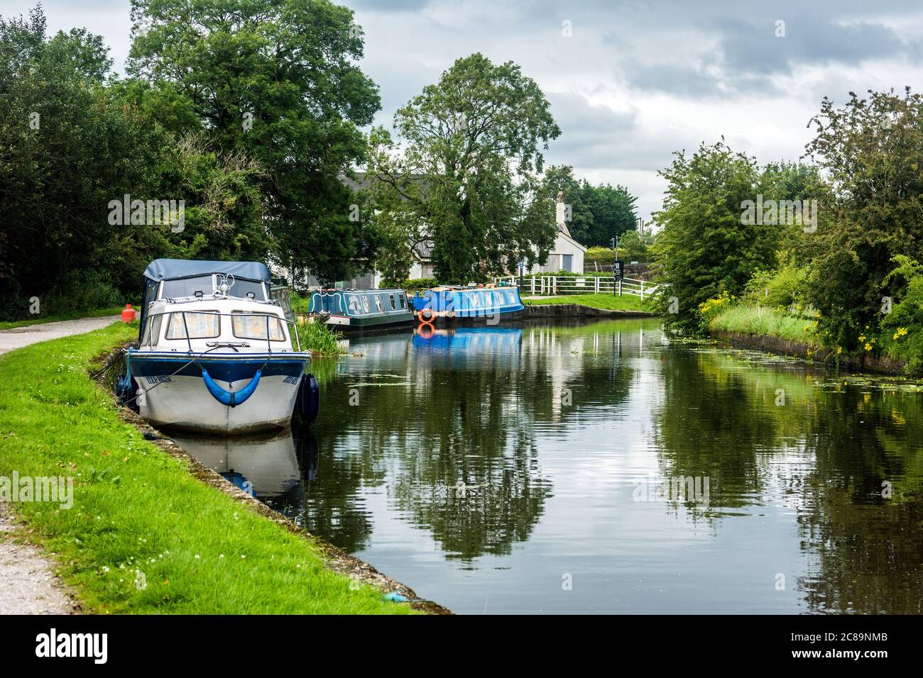 Boats moored at Red Rock on the Leeds - Liverpool canal at Red Rock near Wigan, Lancashire. Stock Photo
