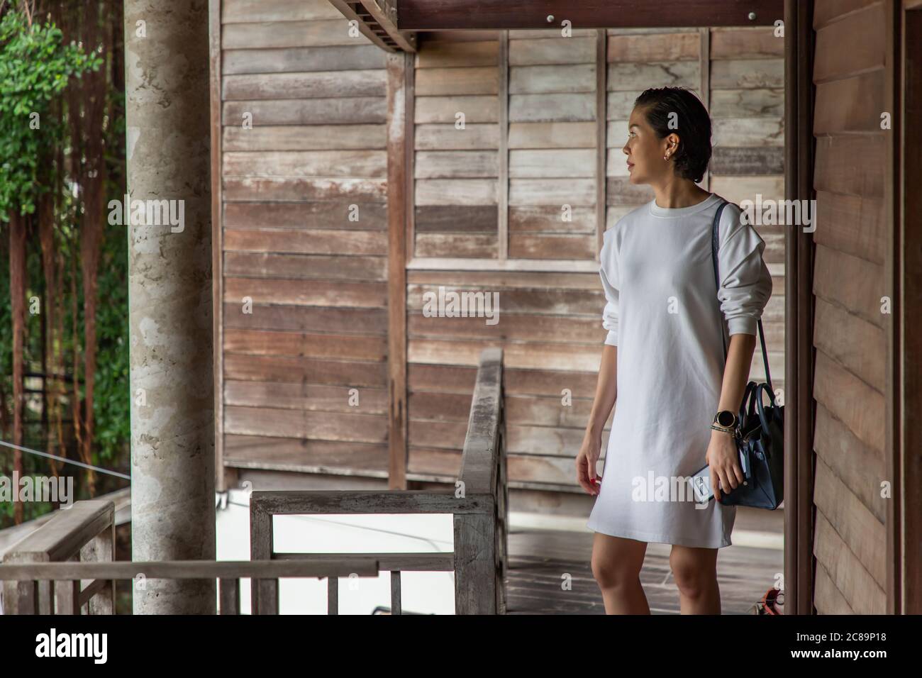 Short-hair asian lady who is take tour in old style village. Wooden house village Stock Photo - Alamy Short-hair asian lady who is take tour in old style village. Wooden house village Stock Photo - Alamy