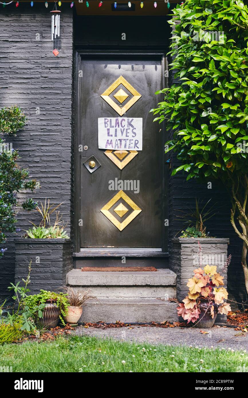 Portland, Oregon, USA - June 10th, 2020: A Black Lives Matter sign posted of a front door in Portland Oregon. Stock Photo