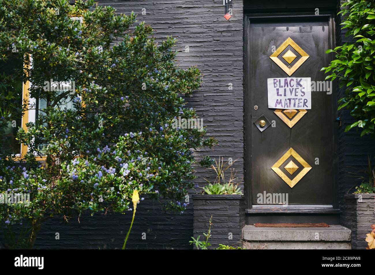 Portland, Oregon, USA - June 10th, 2020: A Black Lives Matter sign posted of a front door in Portland Oregon. Stock Photo
