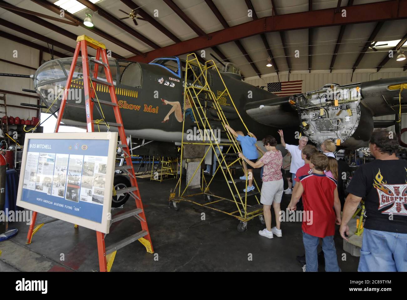 ST. CHARLES, UNITED STATES - Aug 25, 2008: people touring vintage World War II-era USA airplanes at a military museum in Missouri Stock Photo