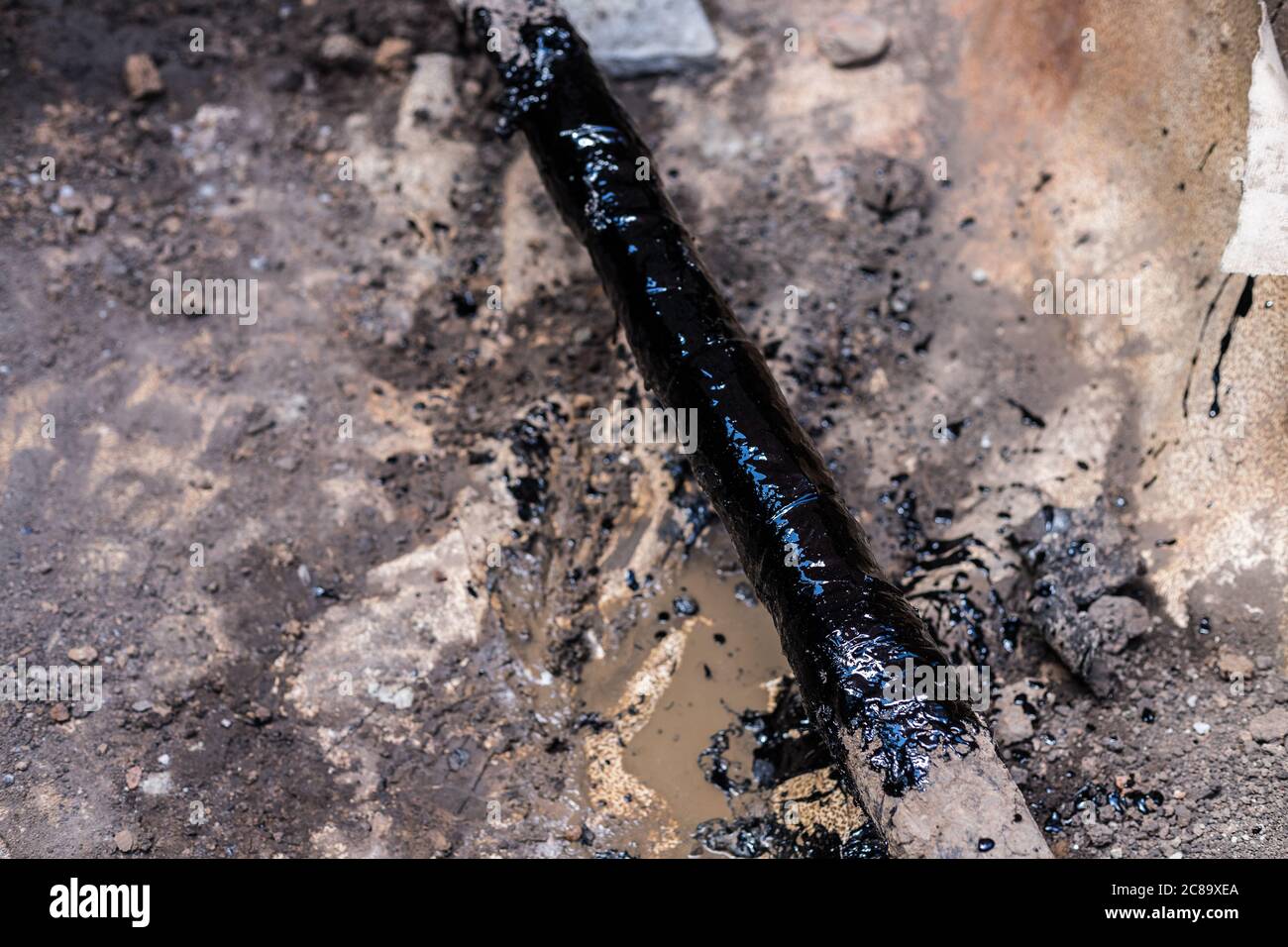 gas pipe in resin. Resin-treated pipe treated with resin. Stock Photo