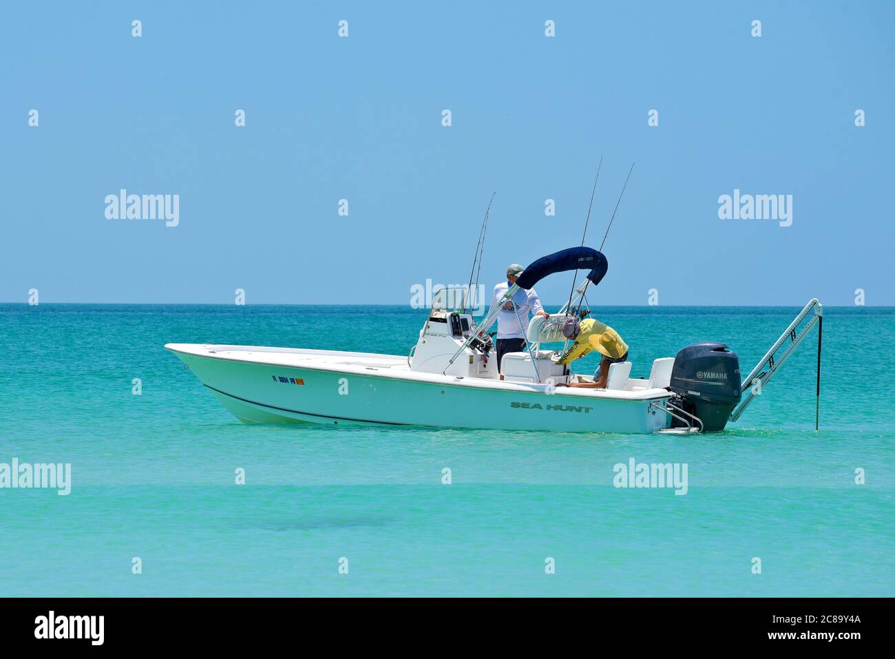 Holmes Beach, Anna Maria Island FL / USA - May 1, 2018: People Fishing from a Power Boat in the Gulf of Mexico Stock Photo