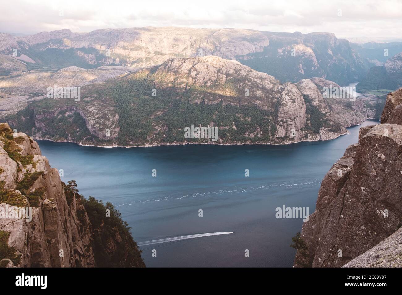High view of boat cruising through fjords in Norway Stock Photo - Alamy