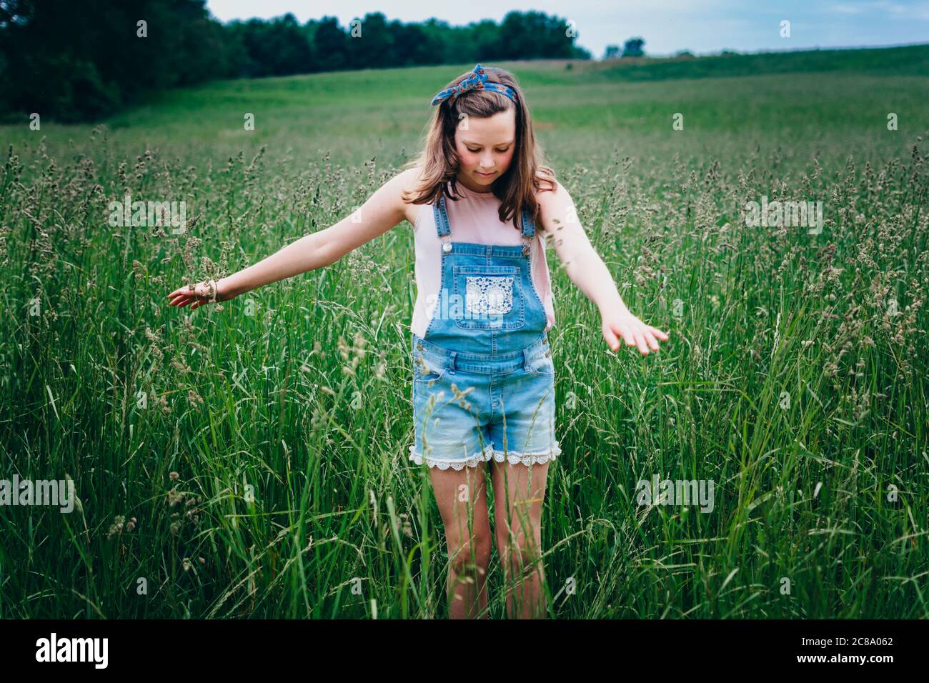 tall teen girls Teen Girl in a Field Running her Hands Through the Tall Grass Stock Photo -  Alamy