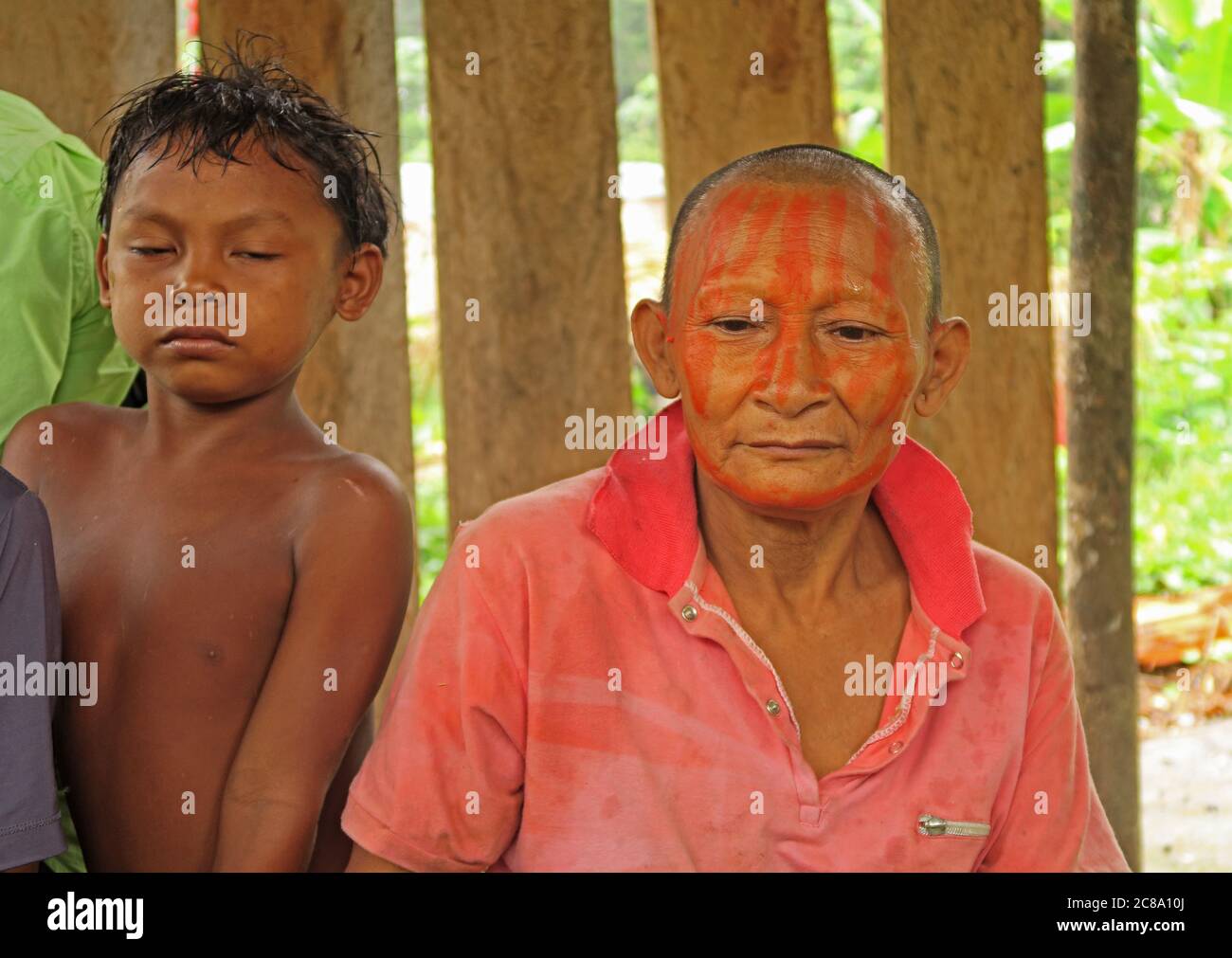 Nukak lady with traditional face paint and boy  Capricho, Guaviare Department; Colombia        November Stock Photo