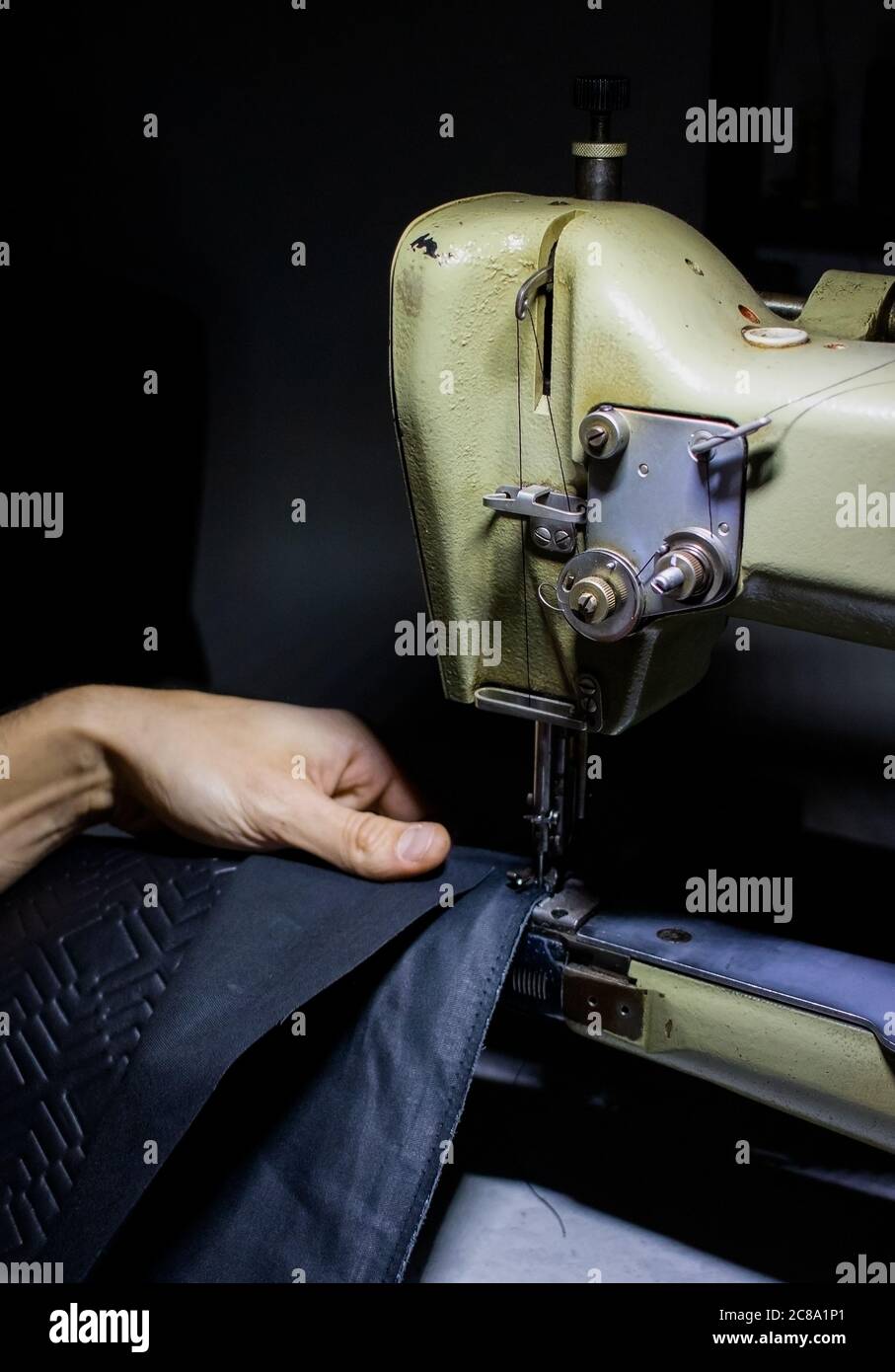 craftsman working with leather and sewing machine Stock Photo